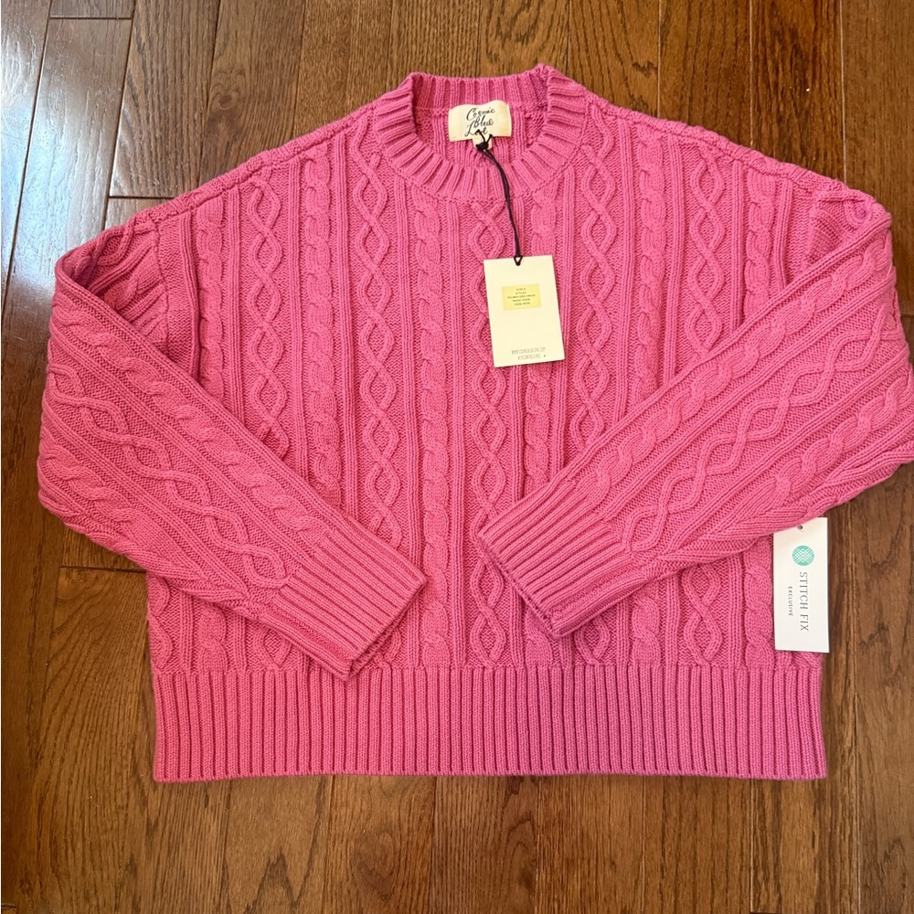 Cosmic Blue Love. Pink Cable Knit Sweater
Brand New with Tags. Size Small.